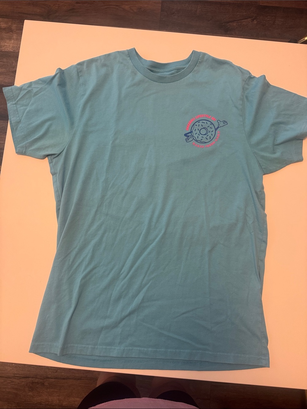 Men's Teal Short-Sleeve Graphic Tee with Pink Accent